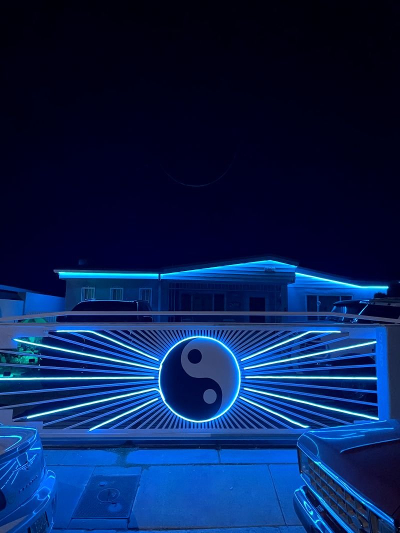 Commercial signage and facade picked out in blue permanent LED lighting